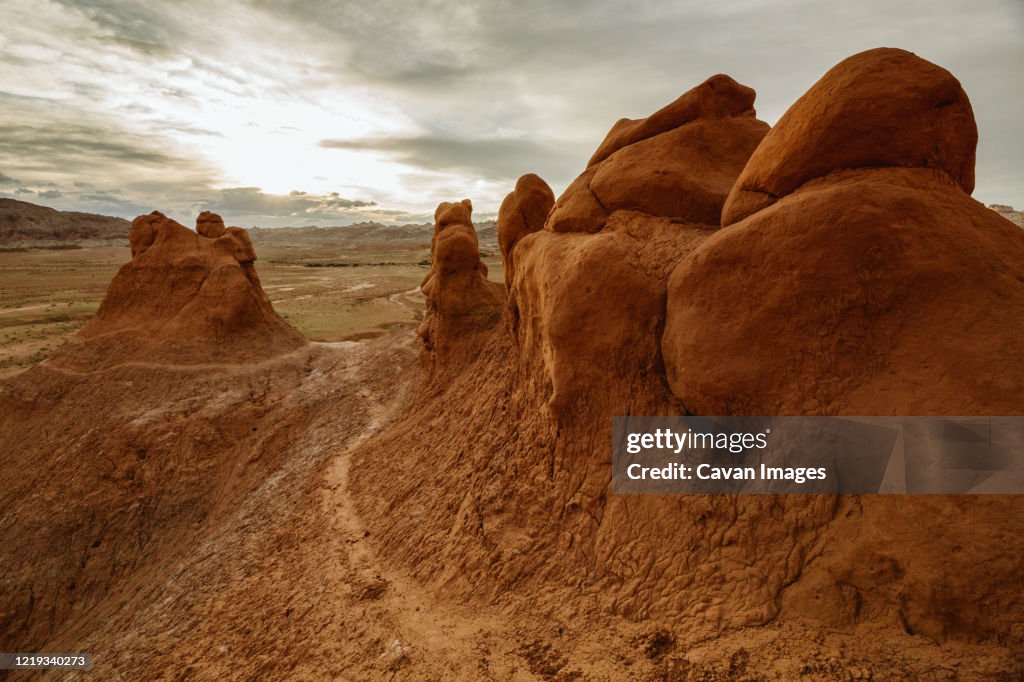Red Clay Path Path Winds Its Way Up Bulbous Red Clay Sandstone Formations At Dusk ...
