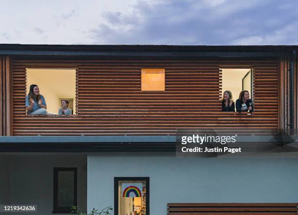 family clapping to show support from their home - cladding stock pictures, royalty-free photos & images