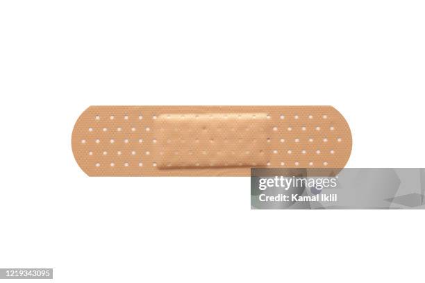 adhesive bandage plaster - parche fotografías e imágenes de stock