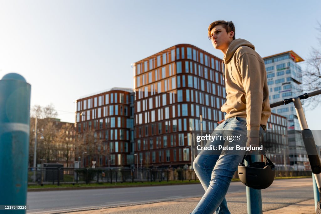 Teenage boy on an electric scooter