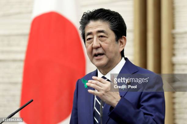 Shinzo Abe, Japan's prime minister, gestures as he speaks during a news conference at the prime minister's official residence on April 17, 2020 in...