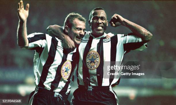 Newcastle strikers Alan Shearer and Les Ferdinand celebrate the fourth goal scored by Shearer during the Premier League match between Newcastle...