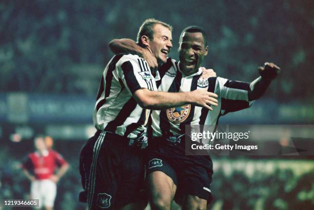 Newcastle strikers Alan Shearer and Les Ferdinand celebrate the fourth goal scored by Shearer during the Premier League match between Newcastle...