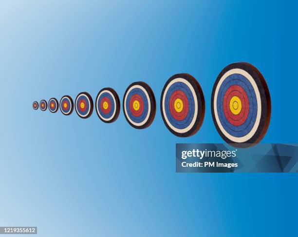 ascending targets on blue - archery target stock pictures, royalty-free photos & images