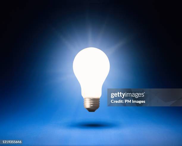 bright idea - lightbulb floating stock pictures, royalty-free photos & images