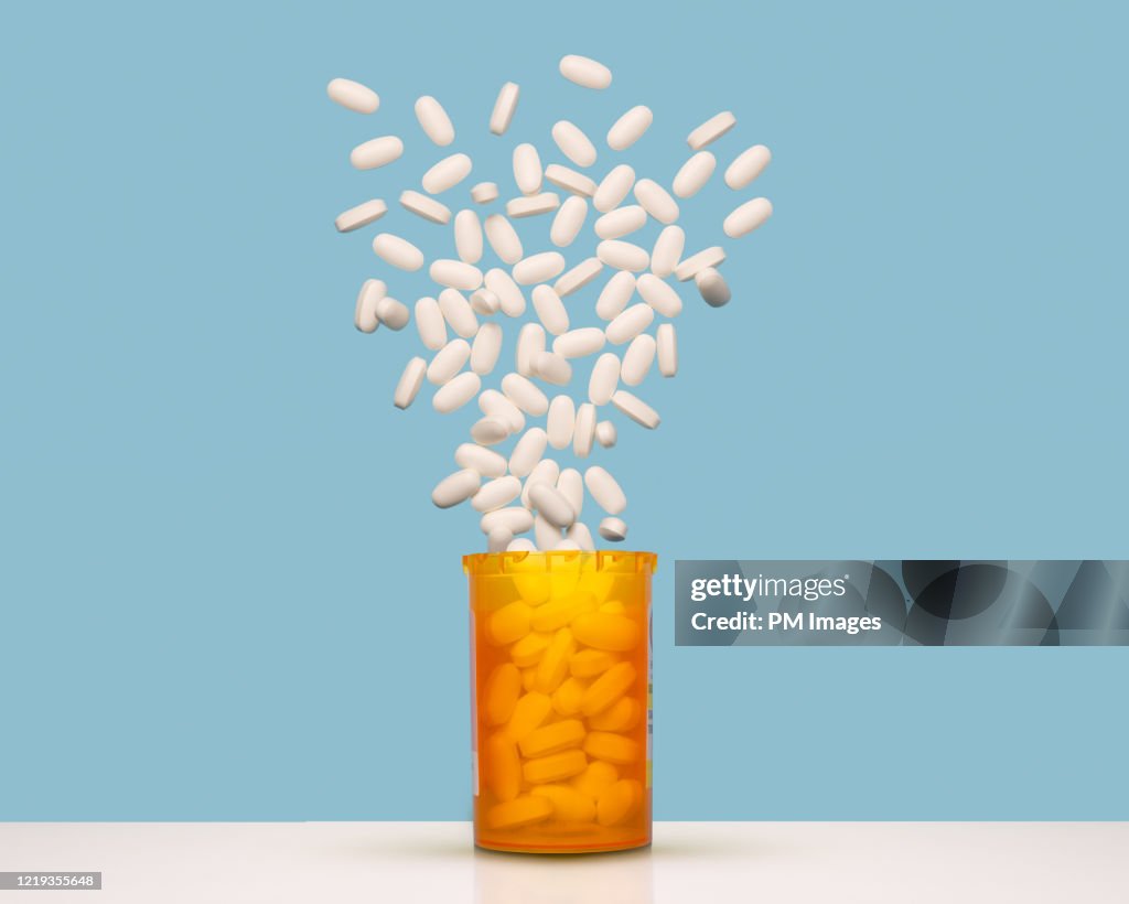 Pills exploding out of bottle