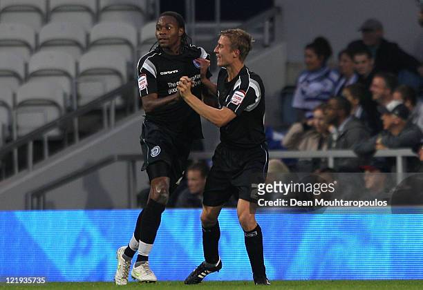 Jean Louis Akpa Akpro of Rochdale celebrates scoring the opening goal with team mate Stephen Darby during the Carling Cup second round match between...