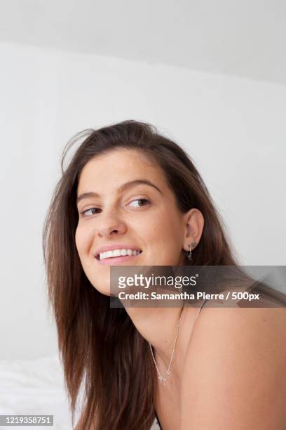 young woman getting ready in bedroom - showus stock pictures, royalty-free photos & images