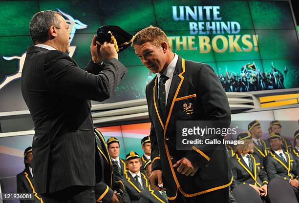 John Smit receives his cap during the South Africa Rugby World Cup Squad announcement and press conference at SuperSport Studios, Randburg on August...