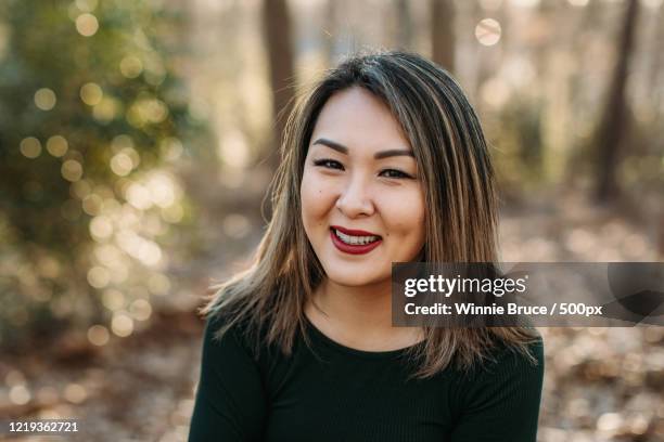 portrait of young woman in forest - showus skin stock pictures, royalty-free photos & images