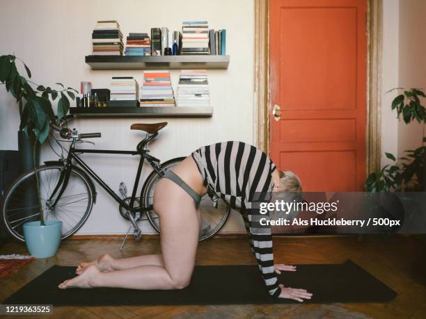 view of mature woman in yoga pose, russia - showus yoga stock pictures, royalty-free photos & images