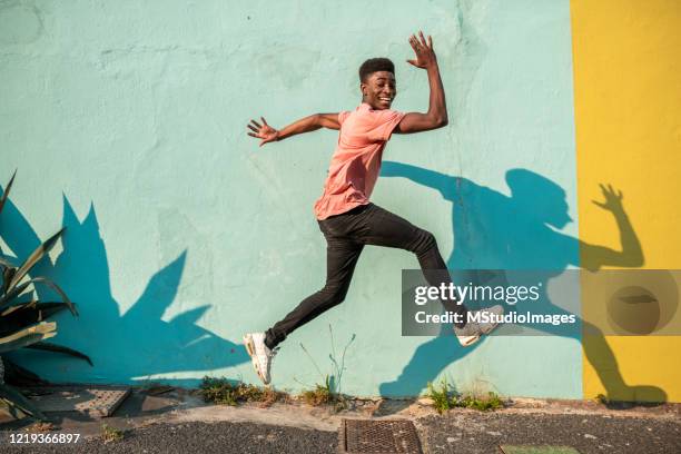 jump! - colour street dance stock pictures, royalty-free photos & images