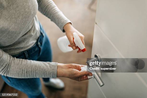 mother teaches kids about hands disinfection - door handle stock pictures, royalty-free photos & images