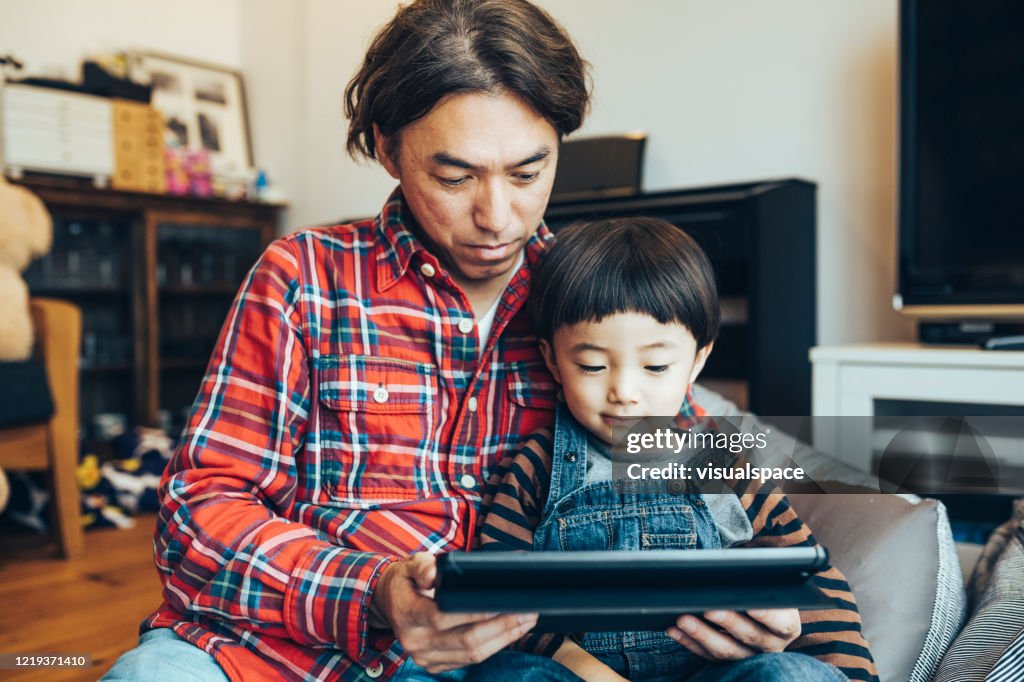 Father and son making a video call