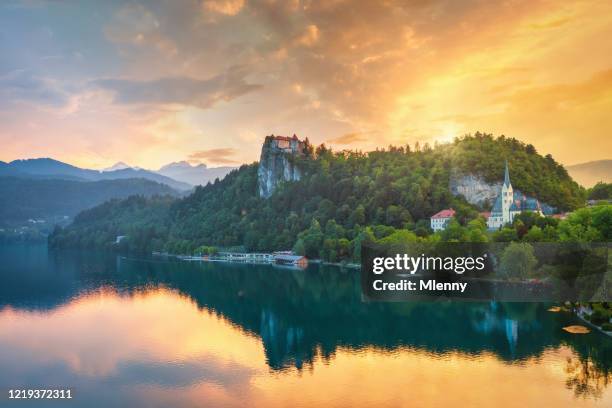 dramatic sunset over lake bled in slovenia - lake bled stock pictures, royalty-free photos & images