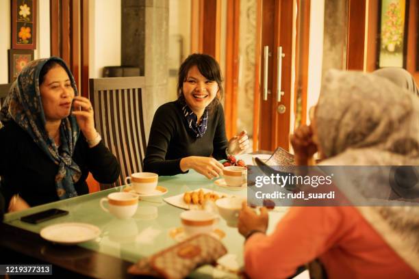 happy asian friends having iftar together - iftar stock pictures, royalty-free photos & images