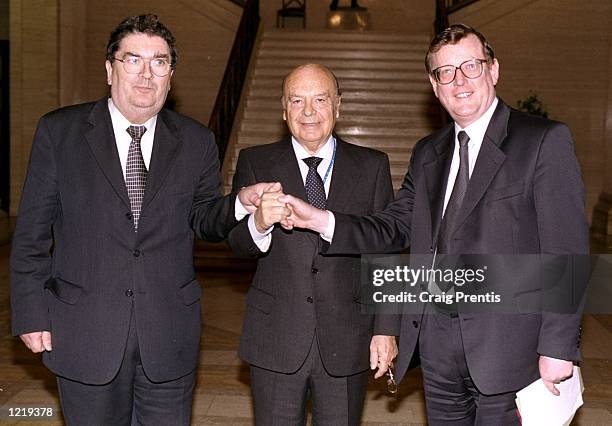 President Primo Nebiolo [centre] meets Leader of the SDLP John Hume [left], and Leader of the Ulster Unionists David Trimble [right] at the Northern...