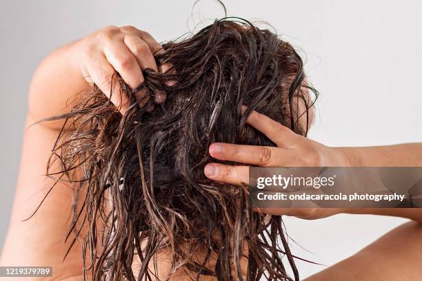 washing hair - hair conditioner stockfoto's en -beelden