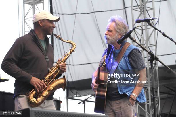 Musicians Branford Marsalis and Bob Weir shown performing on stage during a live concert appearance with Bruce Hornsby on July 20, 2012.