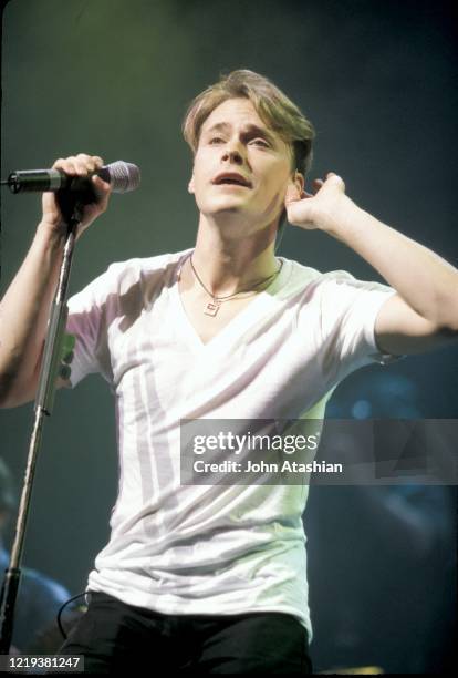 Singer Bryan White is shown performing on stage during a "live" concert appearance on March 10, 1998.