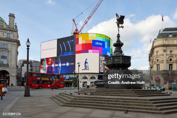 empty deserted area around piccadilly circus during restricted travel of coronavirus covid-19 lockdown in london w1, england - piccadilly circus stock-fotos und bilder