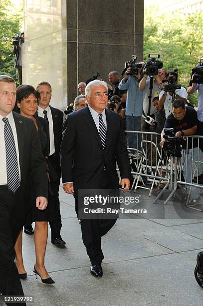 Anne Sinclair and Dominique Strauss-Kahn enter Manhattan Criminal Court to attend a status hearing on the sexual assault charges against Strauss-Kahn...