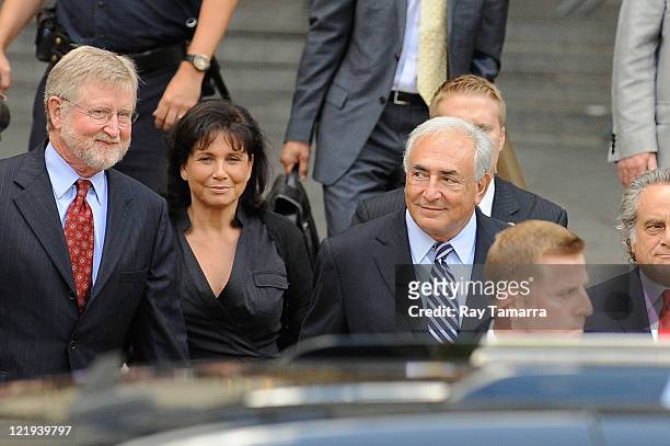 Attorney William Taylor, Anne Sinclair, and Dominique Strauss-Kahn leave Manhattan Criminal Court after attending a status hearing on the sexual...