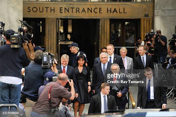 Attorney William Taylor, Anne Sinclair, Dominique Strauss-Kahn, and attorney Benjamin Brafman leave Manhattan Criminal Court after attending a status...