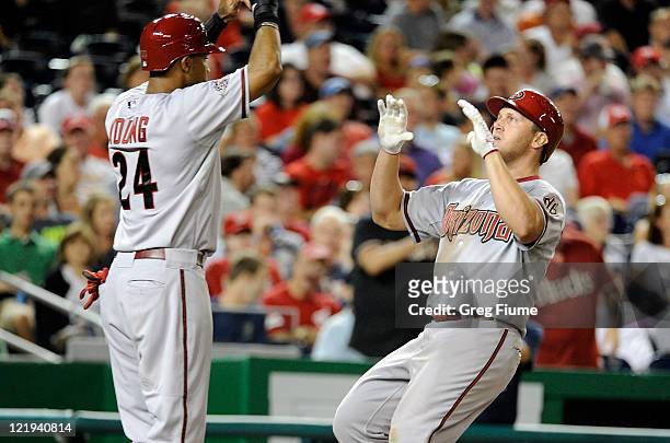 Sean Burroughs of the Arizona Diamondbacks celebrates with Chris Young after hitting a home run in the seventh inning against the Washington...