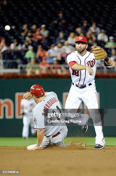 Danny Espinosa of the Washington Nationals forces out Sean Burroughs of the Arizona Diamondbacks to start a double play at Nationals Park on August...