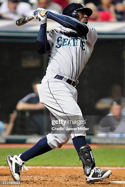 Trayvon Robinson of the Seattle Mariners hits an RBI single during the fifth inning against the Cleveland Indians at Progressive Field on August 23,...