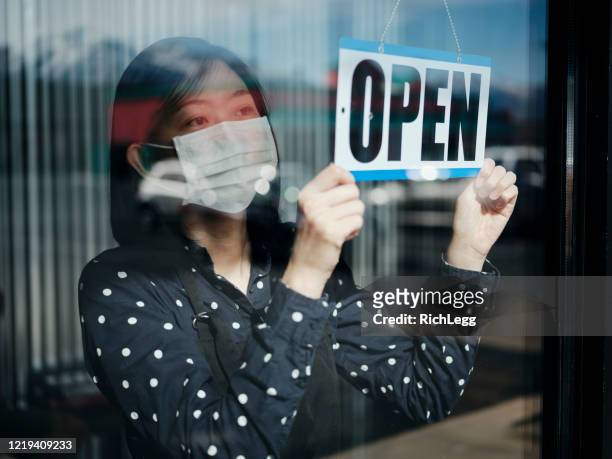 business owner open sign - restaurant manager covid stock pictures, royalty-free photos & images