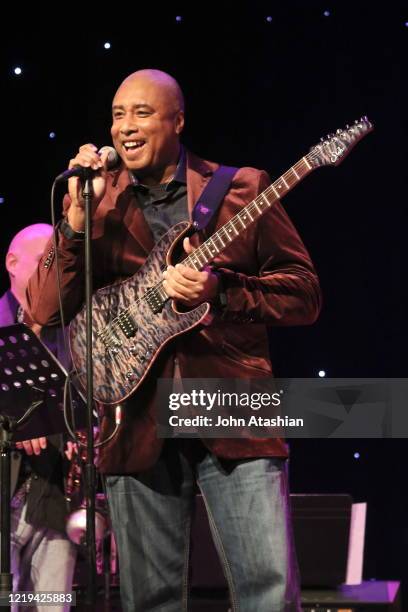 Former New York Yankee outfielder and musician, Bernie Williams is shown performing on stage during a "live" concert appearance with his band on...