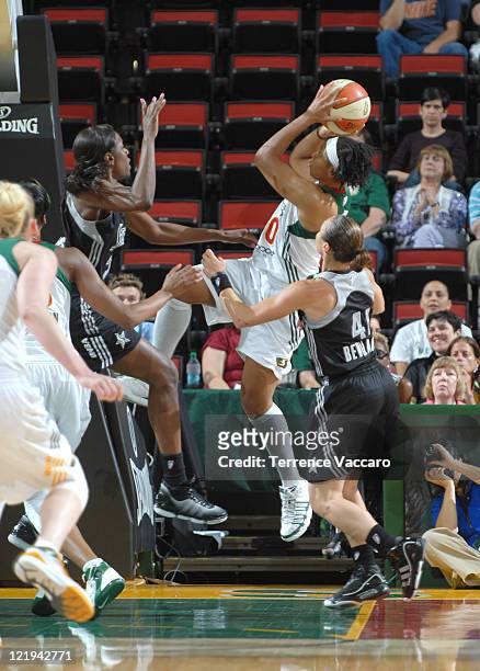 Tanisha Wright of the Seattle Storm shoots against Tully Bevilaqua of the San Antonio Silver Stars during the game on August 23, 2011 at Key Arena in...