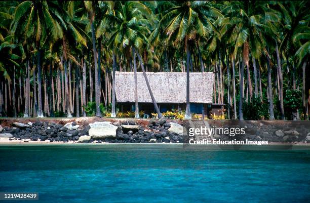 Bungalow in coconut plantation on private island Laucala Fiji now an upscale resort.