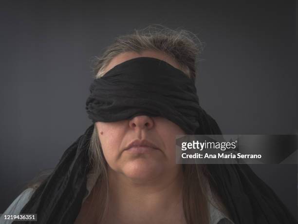 portrait of a woman with a black bandage covering her eyes - redacted stock pictures, royalty-free photos & images