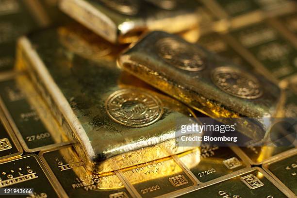 Gold ingots are arranged for a photograph at the Korea Gold Exchange headquarters in Seoul, South Korea, on Wednesday, Aug. 24, 2011. Gold rebounded...