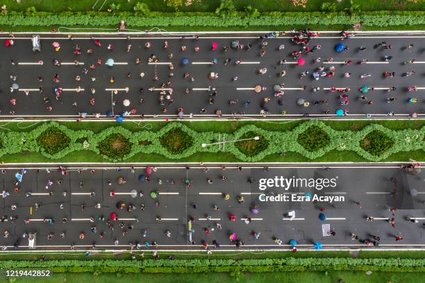 An aerial view shows Filipinos observing social distancing as they take part in a protest against President Duterte's Anti-Terror bill on June 12,...