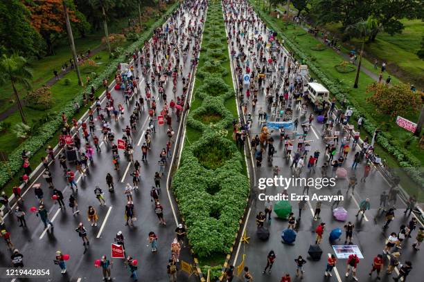 An aerial view shows Filipinos observing social distancing as they take part in a protest against President Duterte's Anti-Terror bill on June 12,...