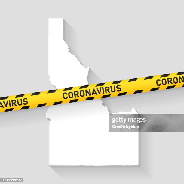 idaho map with coronavirus caution tape. covid-19 outbreak - gray diagonal lines stock illustrations