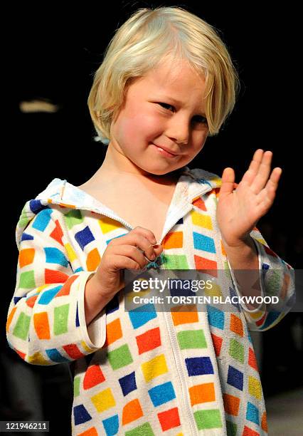 Young boy parades beachwear by the iconic Australian brand 'Speedo' during the Sydney Fashion Festival on August 24, 2011. The annual event showcases...