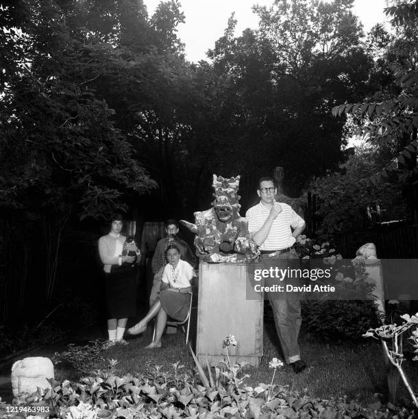 Sculptor Nathaniel Kaz and his wife and children pose for a portrait in the backyard of their brownstone at 36 Grace Court in Brooklyn Heights, in...