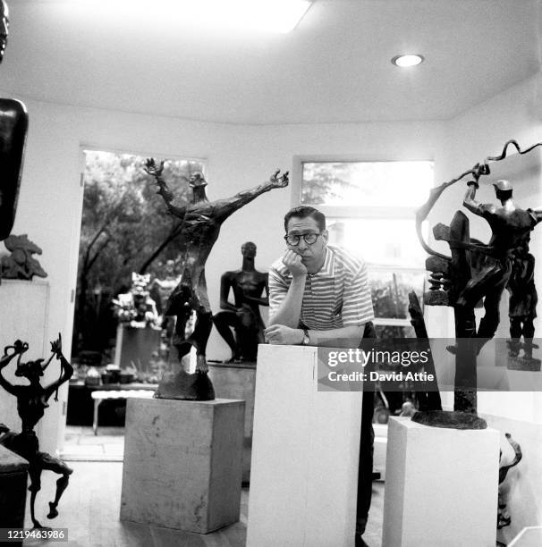 Sculptor Nathaniel Kaz poses for a portrait in his brownstone at 36 Grace Court in Brooklyn Heights, in March, 1958 in New York City, New York.