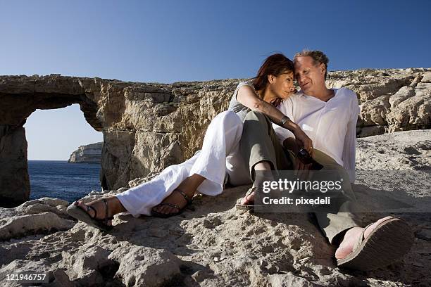 couple at azure window - azure window malta stock pictures, royalty-free photos & images