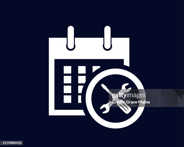 calendar days of the month with a scheduled reminder and a wrench and screwdriver for servicing - agenda meeting stock illustrations