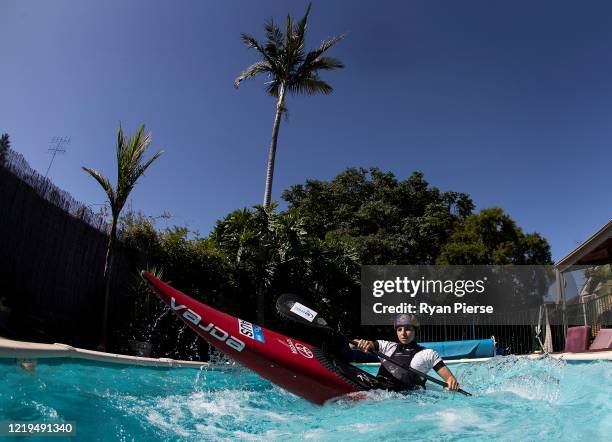 Australian Olympic Canoeist Jess Fox trains in her swimming pool at her home on April 18, 2020 in Sydney, Australia. Athletes across the globe are...