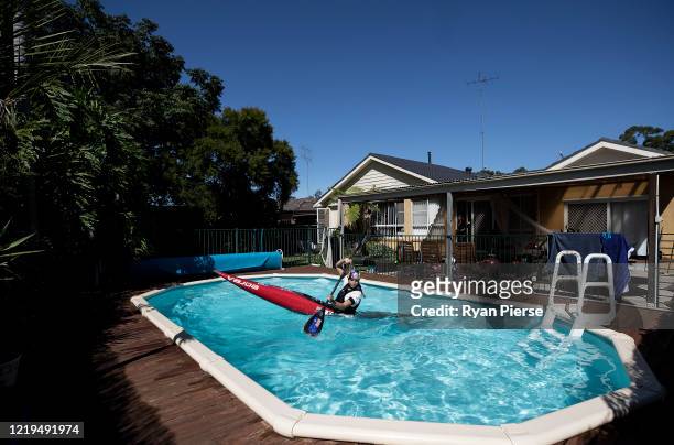 Australian Olympic Canoeist Jess Fox trains in her swimming pool at her home on April 18, 2020 in Sydney, Australia. Athletes across the globe are...