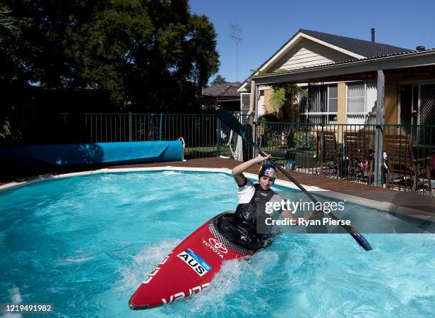 Australian Olympic Canoeist Jess Fox trains in her swimming pool at her home on April 18, 2020 in Sydney, Australia. Athletes across the globe are...