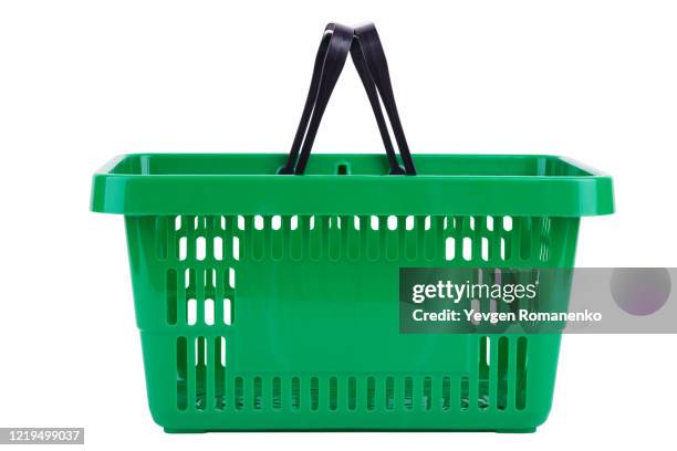 side view of green plastic shopping basket isolated on white background - basket stock-fotos und bilder