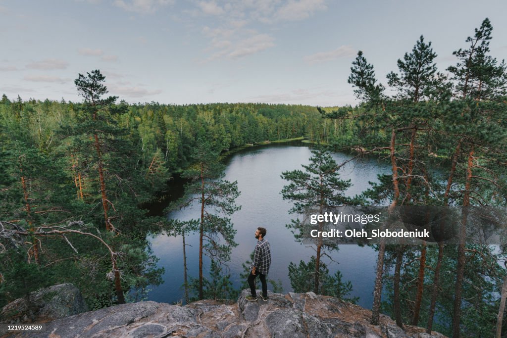 Man walking near the lake in summer